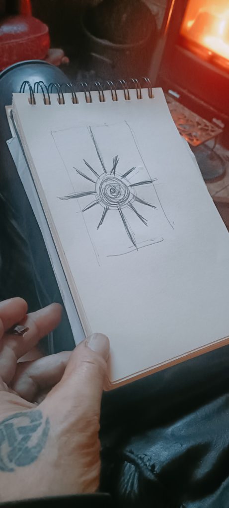 sketchbook by the fire with radial design on first page