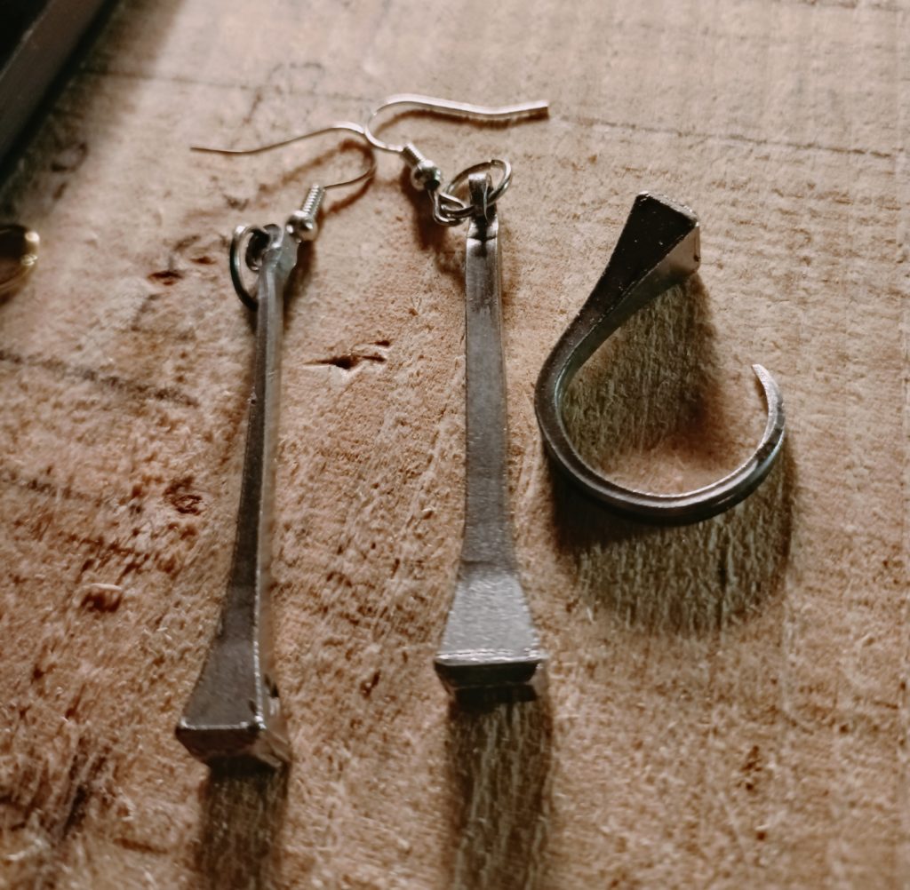 Long horseshoe nail earrings and a small horseshoe nail ring